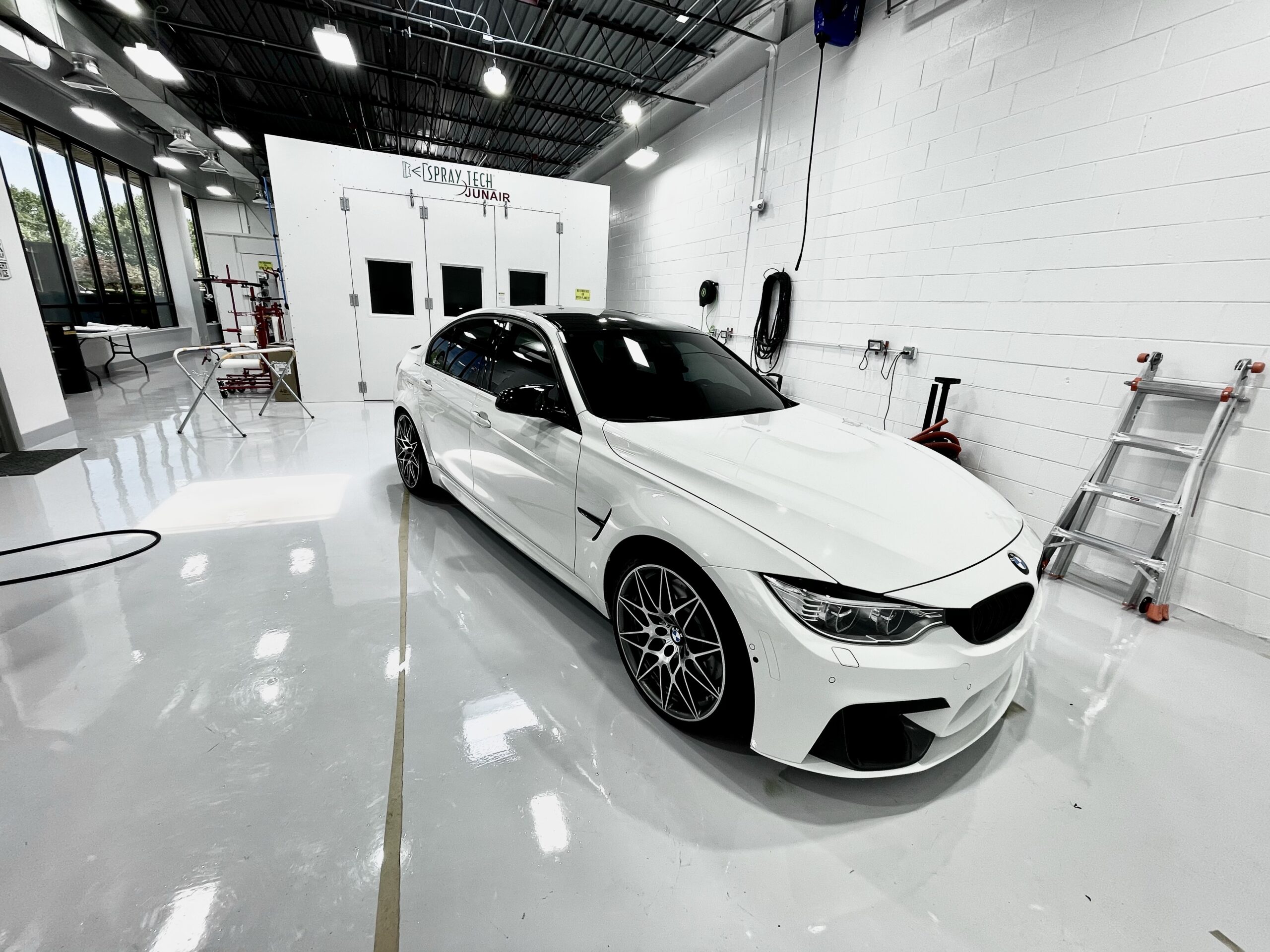 picture of white car in detailing shop